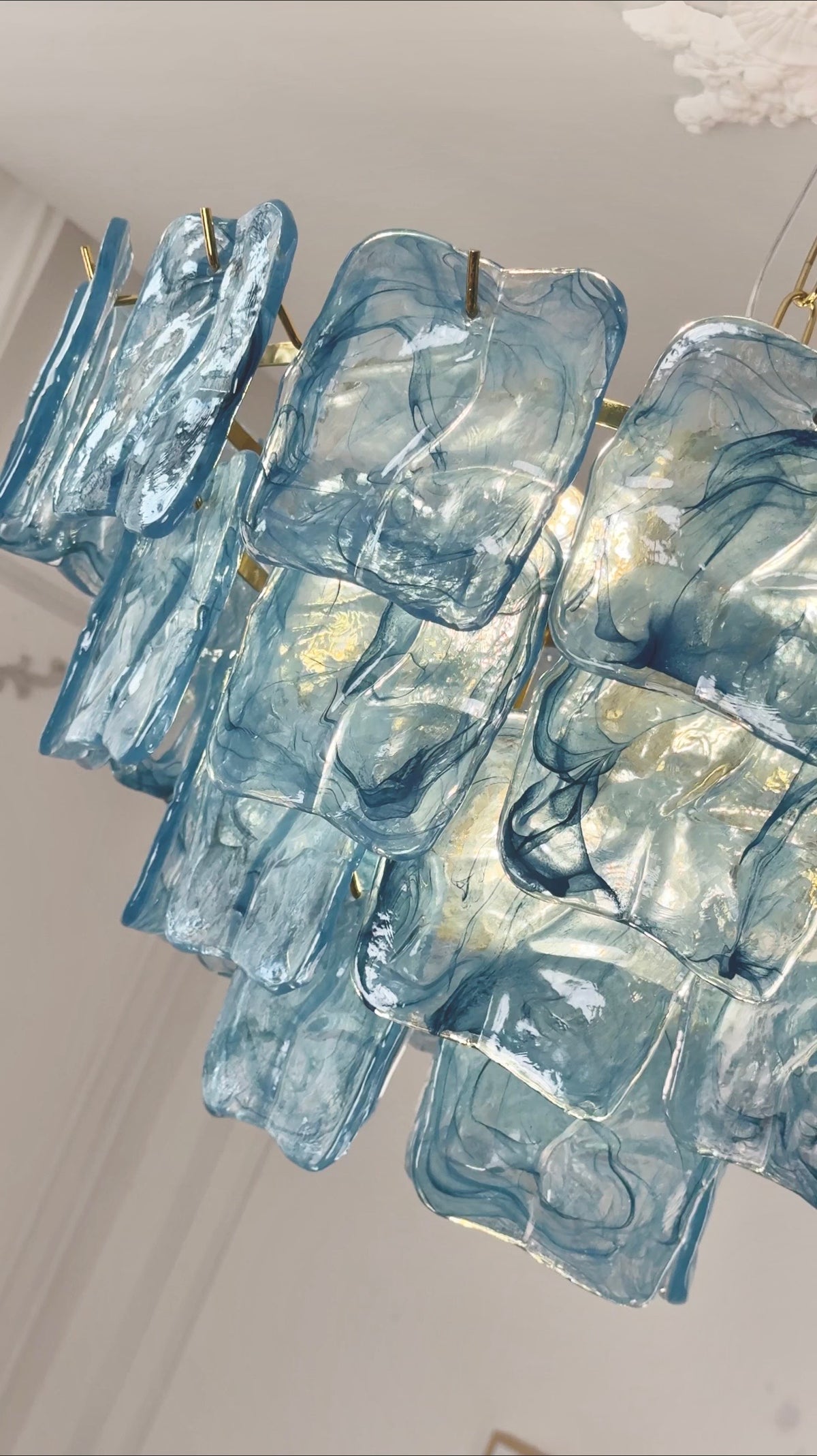Close-up of blue Aureate Cascade Murano-style textured glass chandelier